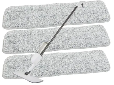 Three mop pads are stacked, with a spray mop handle resting on them.