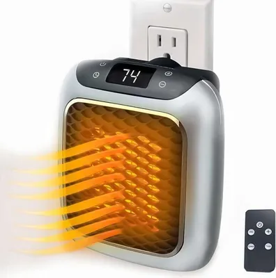 A compact electric heater plugged into a wall outlet, emitting heat.