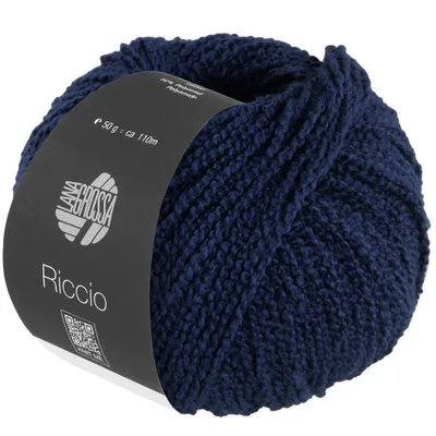 A ball of navy blue yarn with a label wrapped around it.
