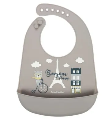A baby bib with a cartoon illustration of Paris.