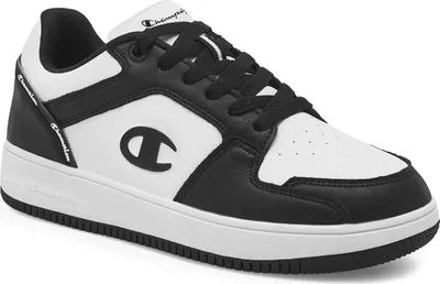 A studio shot of a single black and white Champion sneaker.