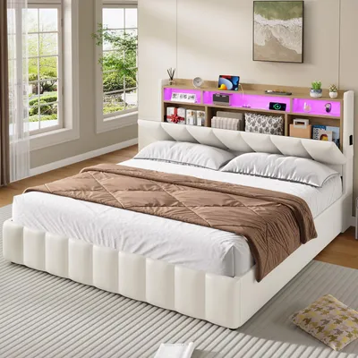 A bedroom scene featuring a beige upholstered bed with a headboard containing LED lighting and storage.