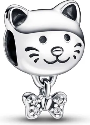 A silver cat charm with a small bow dangling from its neck.