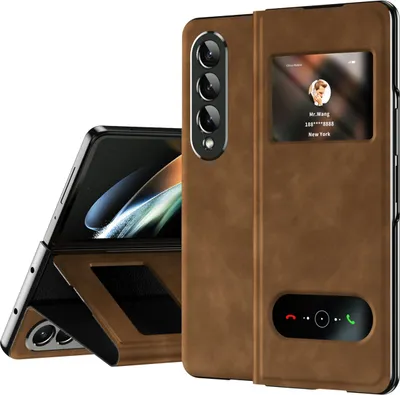 A brown leather flip case for a Samsung Galaxy Z Fold4 phone is shown, with the phone partially open and displayed inside the case. The case has a view window showing a contact card and a touch-sensitive area for call controls.