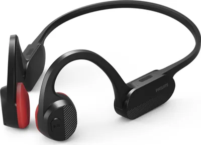 A pair of black and red bone conduction headphones on a white background.