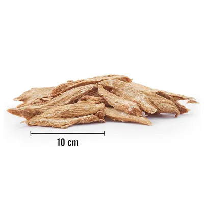 A pile of dried meat strips for dogs, with a ruler indicating 10 cm.