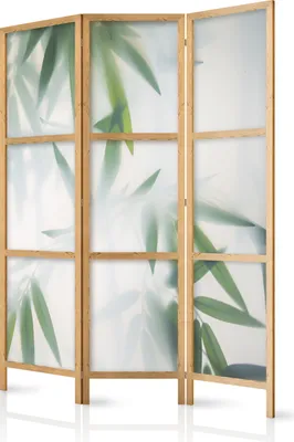 A three-panel room divider with a bamboo leaf design on frosted glass.