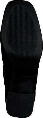 The sole of a black boot is shown against a white background.