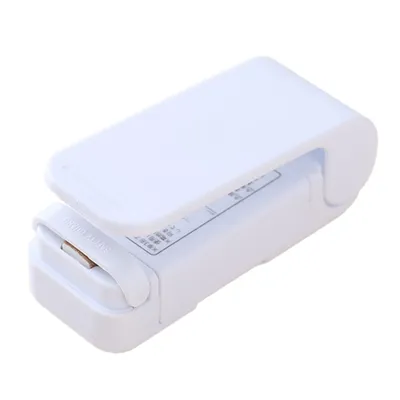 A white handheld plastic bag sealer is shown against a white background.