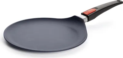 A close-up, studio shot of a crepe pan on a white background.