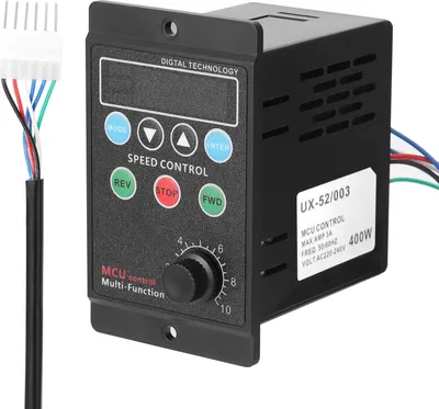 A black electronic speed controller with a digital display and control buttons, connected to a wire harness.