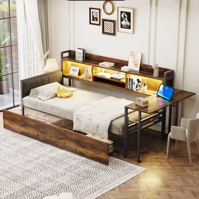 A bedroom or living space with a multi-functional bed, desk, and storage unit.