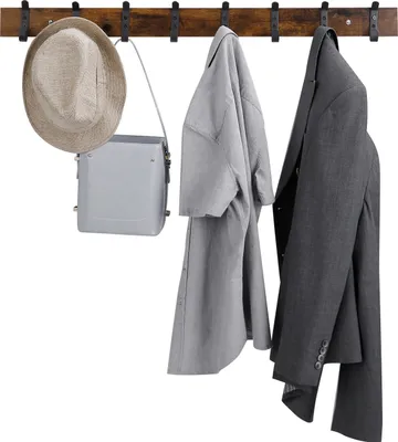 A wooden coat rack with hooks, displaying a hat, a handbag, and two jackets.
