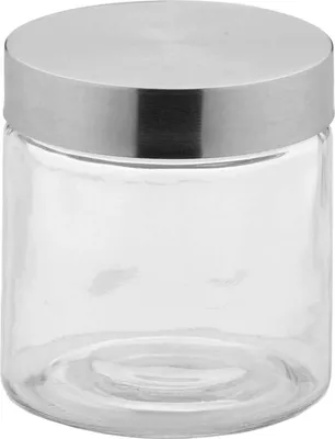 A clear studio shot of a glass storage jar with a silver lid.