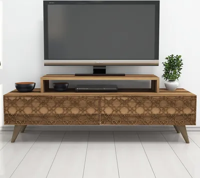 A TV stand with a TV on it, in a room.
