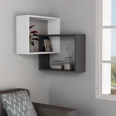A modern living room corner with a white and gray wall-mounted shelf unit.
