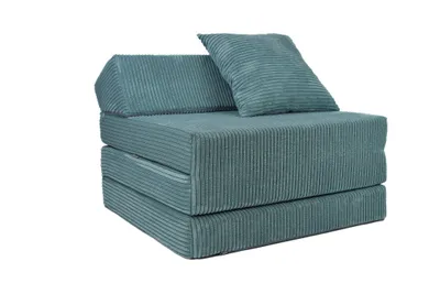A folded floor mattress with a headrest and a pillow, all covered in turquoise corduroy fabric, is shown against a white background.