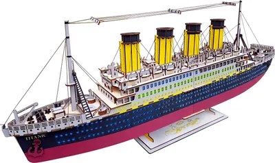 A 3D wooden model of the Titanic ship is displayed against a white background.