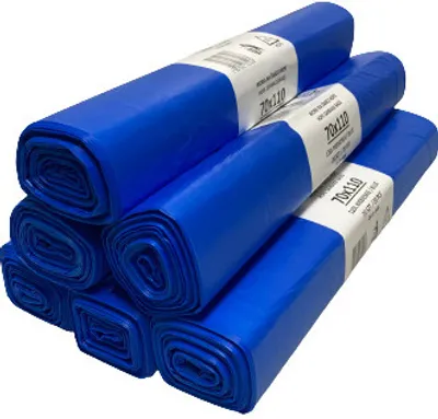 A stack of rolled-up blue trash bags.