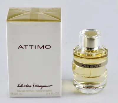 A product shot of a perfume bottle and its box, presented side-by-side against a neutral background.