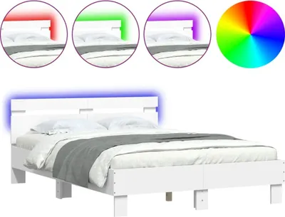 A white bed frame with LED lighting in blue, red, green, and purple, shown in a studio setting with a white background.