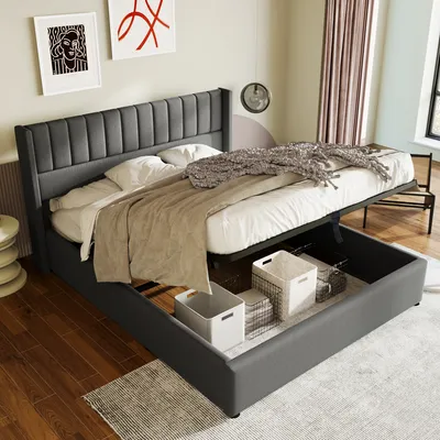 A grey upholstered bed frame with storage is shown with the mattress lifted to reveal storage bins underneath.