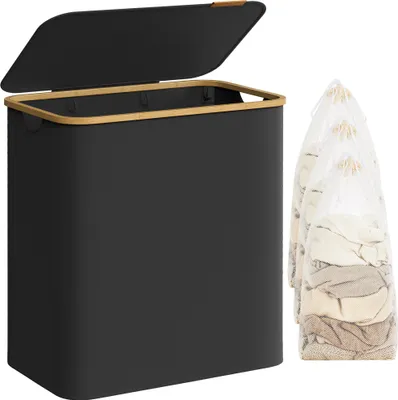 A black laundry hamper with a bamboo rim and lid is shown next to three mesh laundry bags filled with clothes.