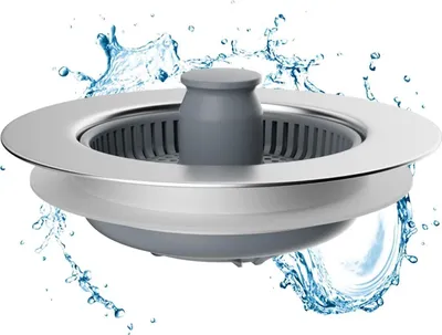 A sink strainer with water splashing around it.