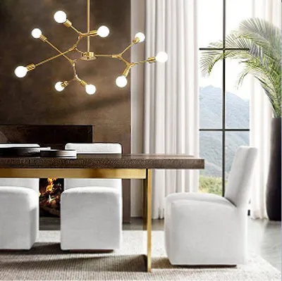 A dining room with a chandelier, table, chairs, and a fireplace.