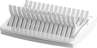 A white plastic dish rack with multiple slots for drying dishes.