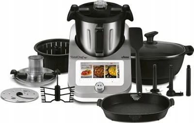 A kitchen appliance with various accessories laid out around it.