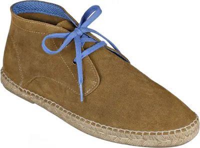 A single brown suede chukka boot with blue laces and blue patterned lining, shown from a diagonal angle on a white background.