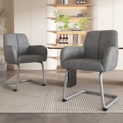 Two gray dining chairs with metal legs are shown in a dining room setting.