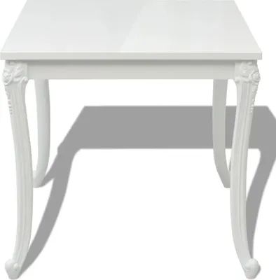 A white dining table with ornate legs, shown from a front-facing angle on a white background.