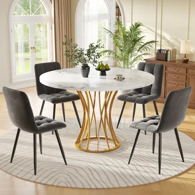 A dining table set with four chairs in a well-lit room with large windows and a sideboard.