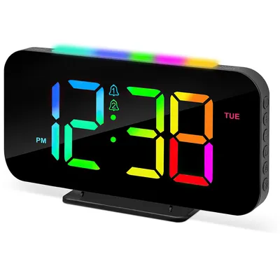 A digital alarm clock with a colorful LED display and a rainbow light strip at the top.
