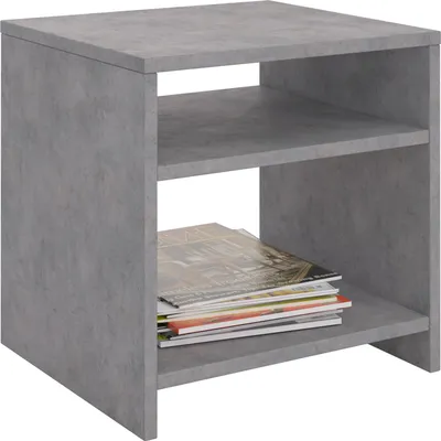 A modern, gray, concrete-look side table with two shelves, one of which holds a stack of magazines.