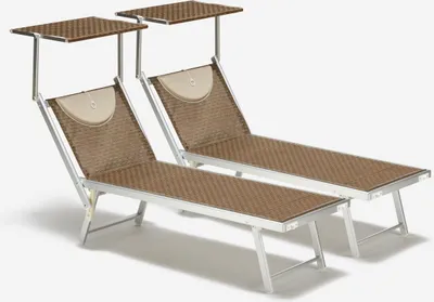 Two beach chairs with sunshades against a white background.