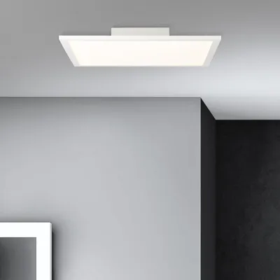 A modern LED ceiling light fixture mounted on a gray ceiling, with gray and black walls in the background.