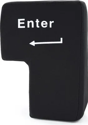 A black Enter key shaped stress ball with white text and an arrow.
