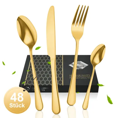 A set of golden cutlery is displayed in front of a black box with a honeycomb pattern.