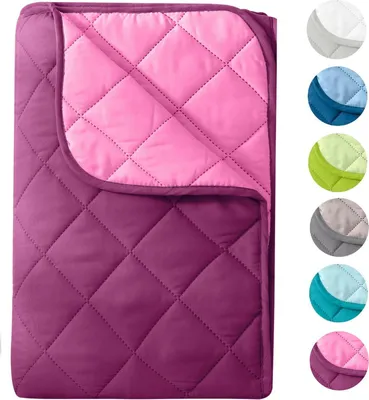 A quilted blanket folded and displayed on a white background, with a row of color swatches on the right.