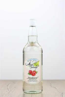 A clear studio shot of a bottle of Alpenschnaps Steinbeisser Himbeere Obstbrand.