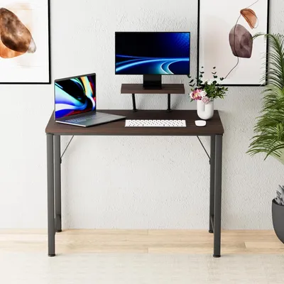 A desk setup with a laptop, monitor, and keyboard.