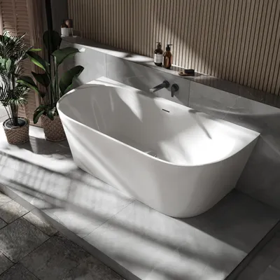 A modern bathroom with a freestanding bathtub, plants, and wooden wall paneling.