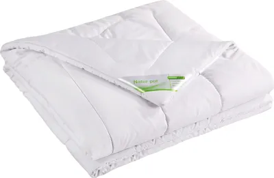 A folded white duvet is shown against a white background.