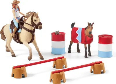 A toy set featuring a girl riding a horse, a horse in a costume, barrels, and obstacle jumps.