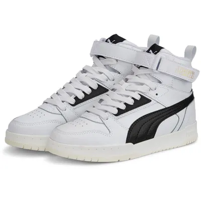 A pair of white and black Puma Rebound Game sneakers for children.
