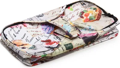 A folded shopping bag with a print of various desserts and handwritten text.