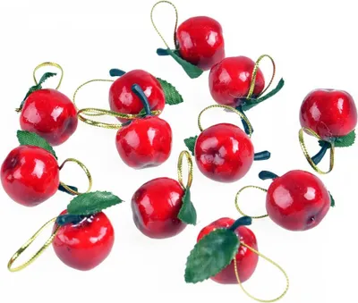 A collection of small, red, apple-shaped ornaments with green leaves and gold hanging loops, arranged on a white background.